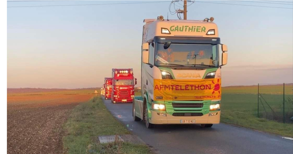 Camion des Transports Gauthier participant à un événement du Téléthon pour soutenir la collecte de fonds.